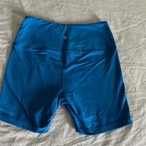 Neon blue 90 degree by reflex bike shorts. Size medium.
